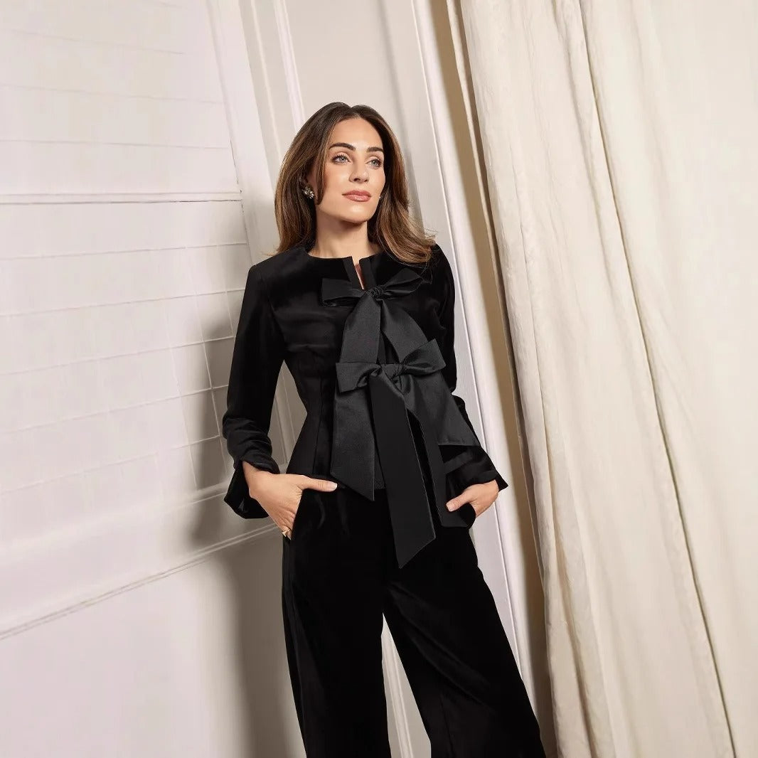 Peplum jacket in bespoke taffeta with velvet bow detail