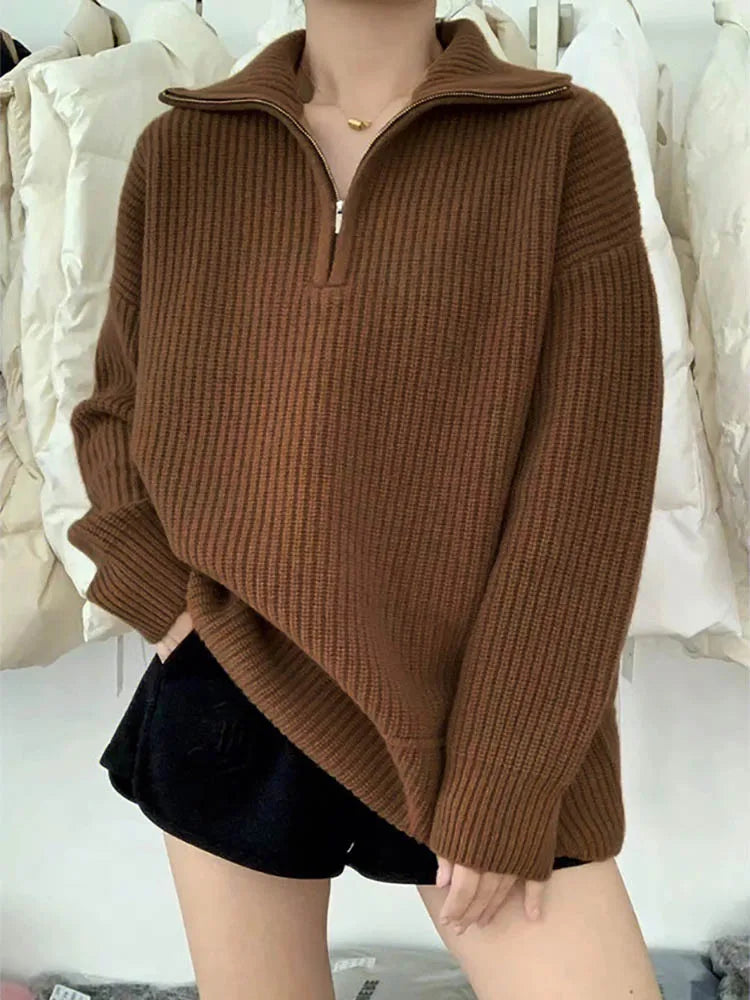 Cozy thick knit sweater with zip collar for autumn layering.