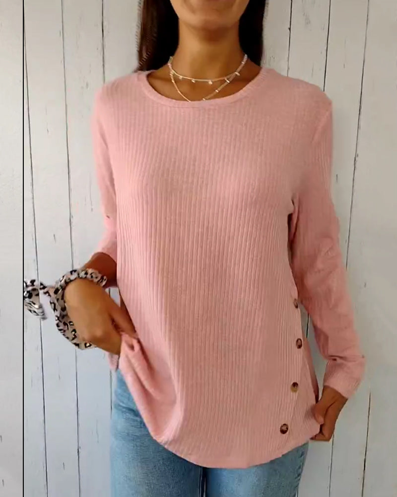 Cozy ribbed knit top with a round neckline and long sleeves