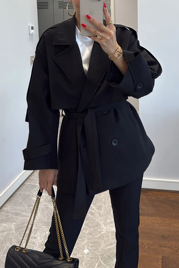 Fashionable urban trench coat with belt, lapels and button details