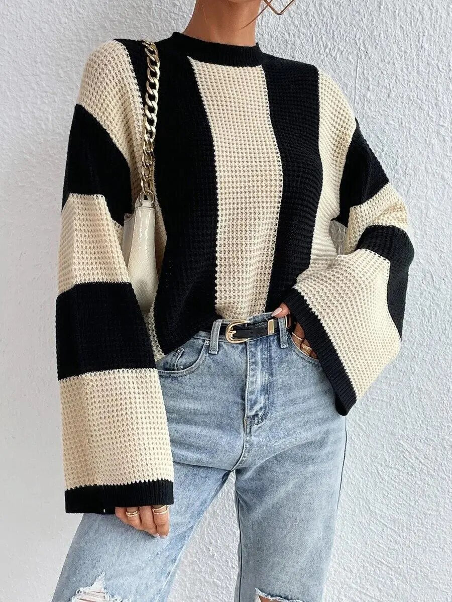 Cozy two-tone knit sweater with wide, casual sleeves