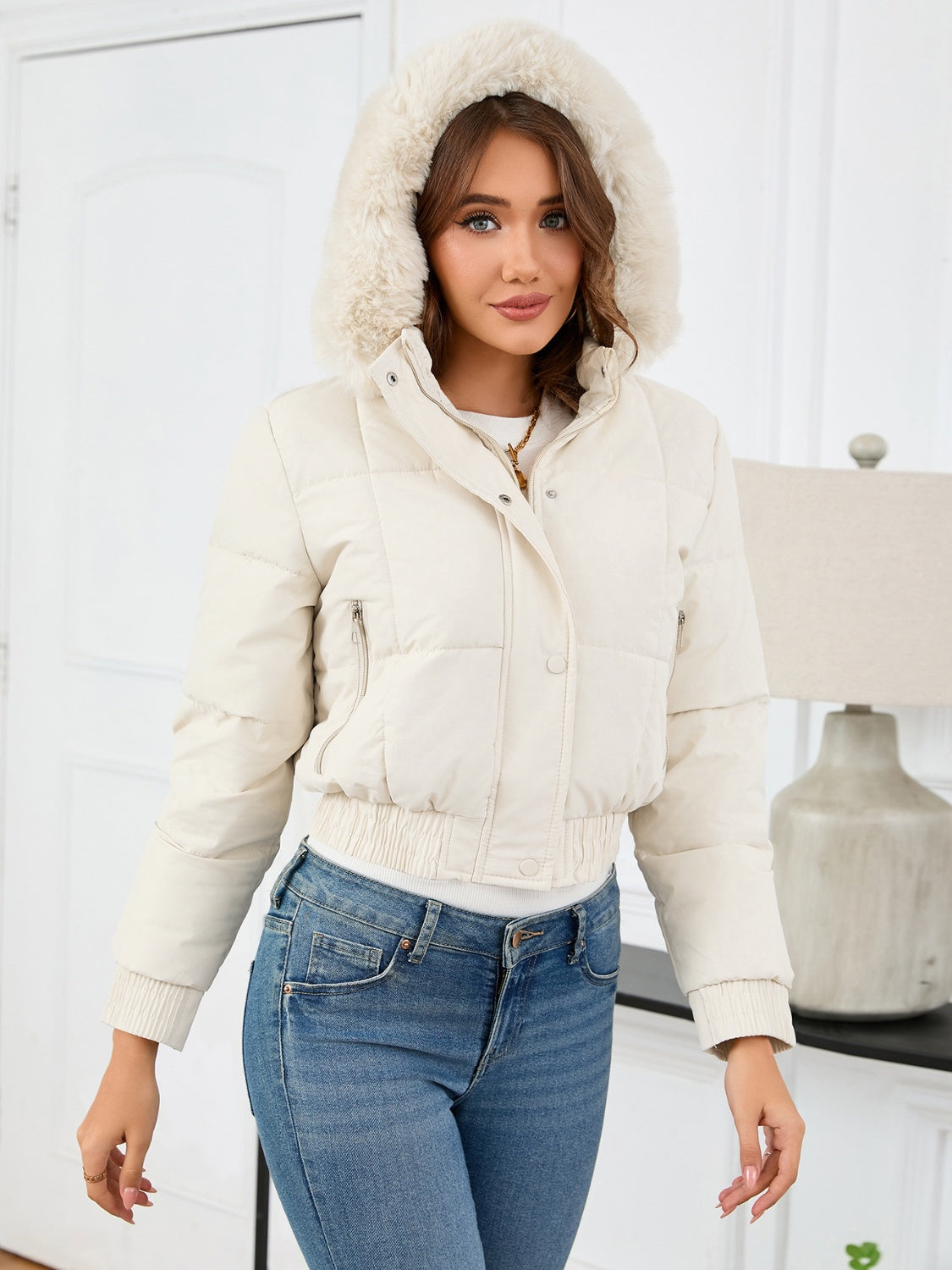 Cozy padded winter jacket with fur hood and pockets 