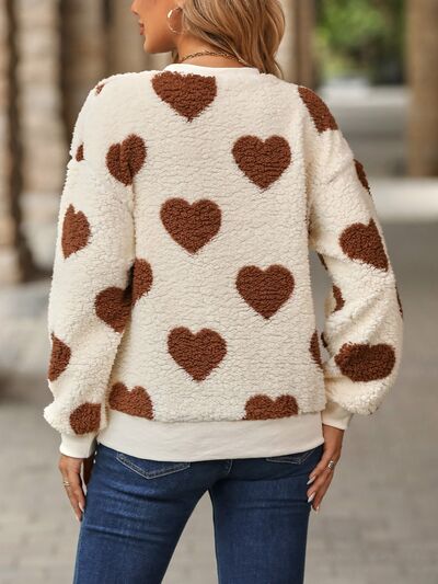 Cozy knit sweater with a heart pattern for casual comfort 