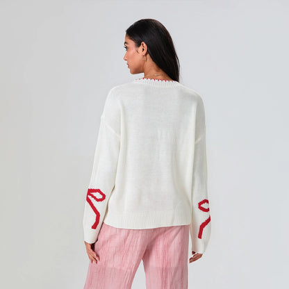 Frieda | Festive knitted sweater with bow design
