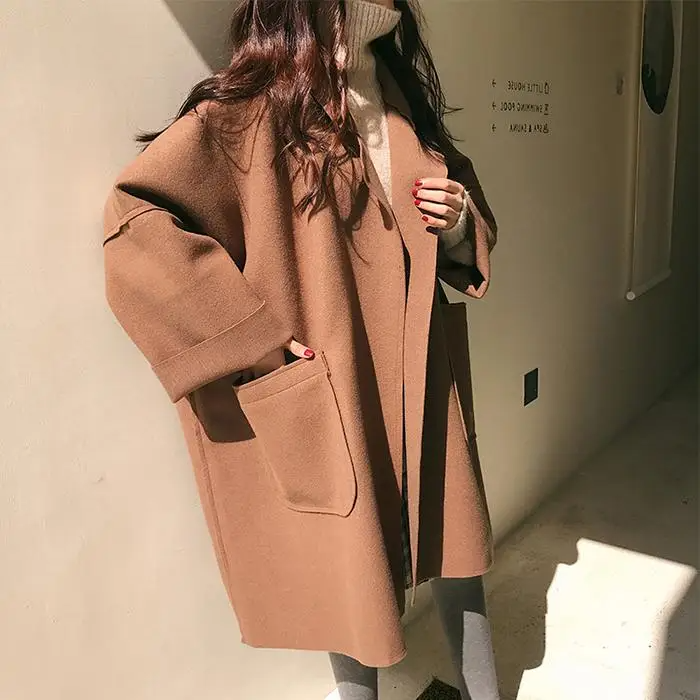 Oversized wool-blend coat with pockets and a relaxed fit 