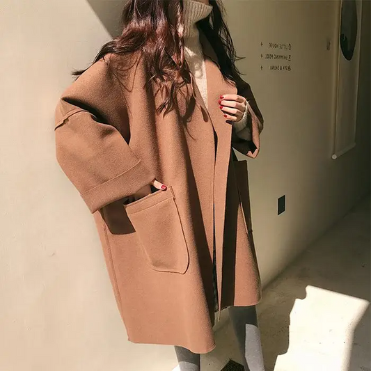 Oversized wool-blend coat with pockets and a relaxed fit 