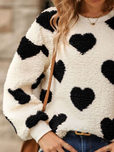 Cozy knit sweater with a heart pattern for casual comfort 