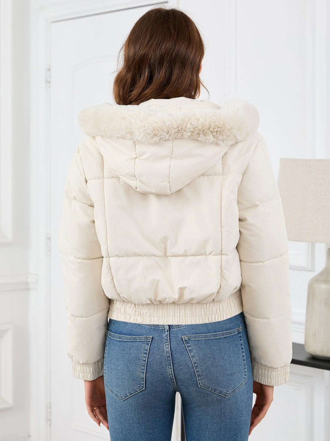 Cozy padded winter jacket with fur hood and pockets 