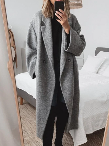 Elegant long coat with double button placket and wide cut 