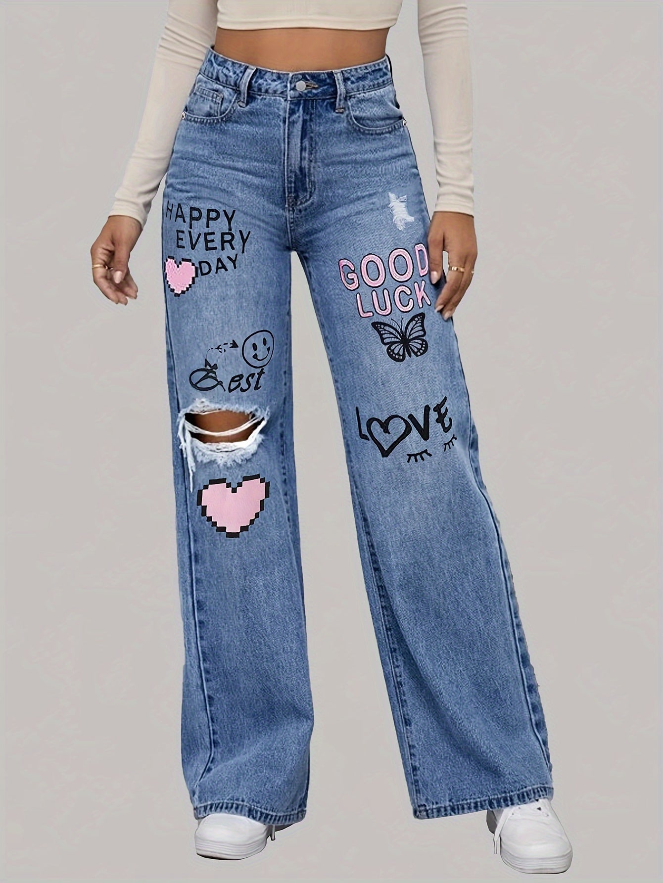 High-waisted jeans with wide leg and graphic design