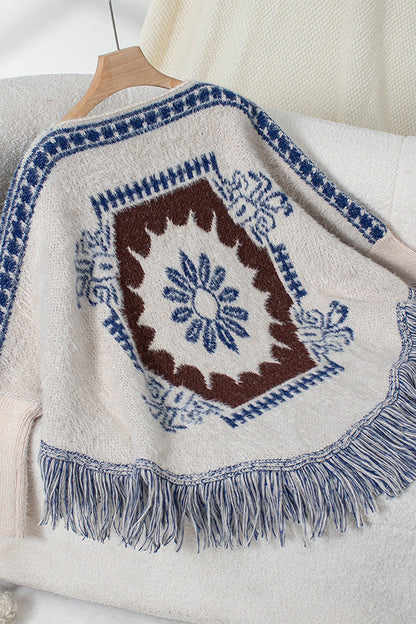 Boho knit sweater with tassel hem 