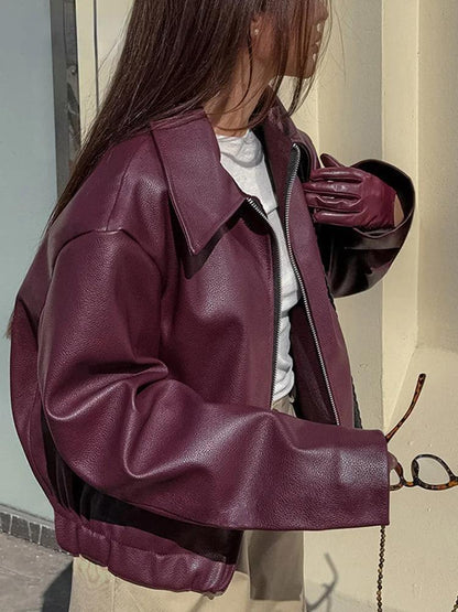 Bordeaux red faux leather jacket with stylish lapel collar and zipper details 