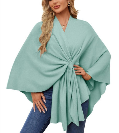 Soft, elegant shawl poncho for cozy-chic layering. 