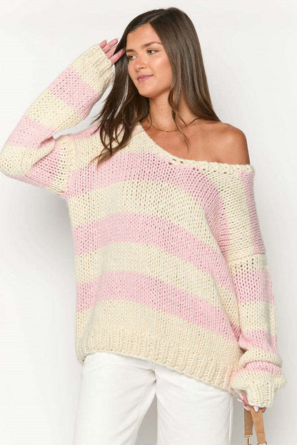 Cozy striped knit sweater with off-the-shoulder design. Chic autumn sweater. 