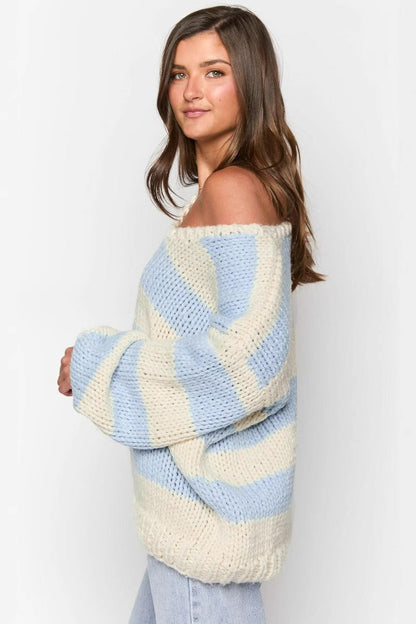 Cozy striped knit sweater with off-the-shoulder design. Chic autumn sweater. 
