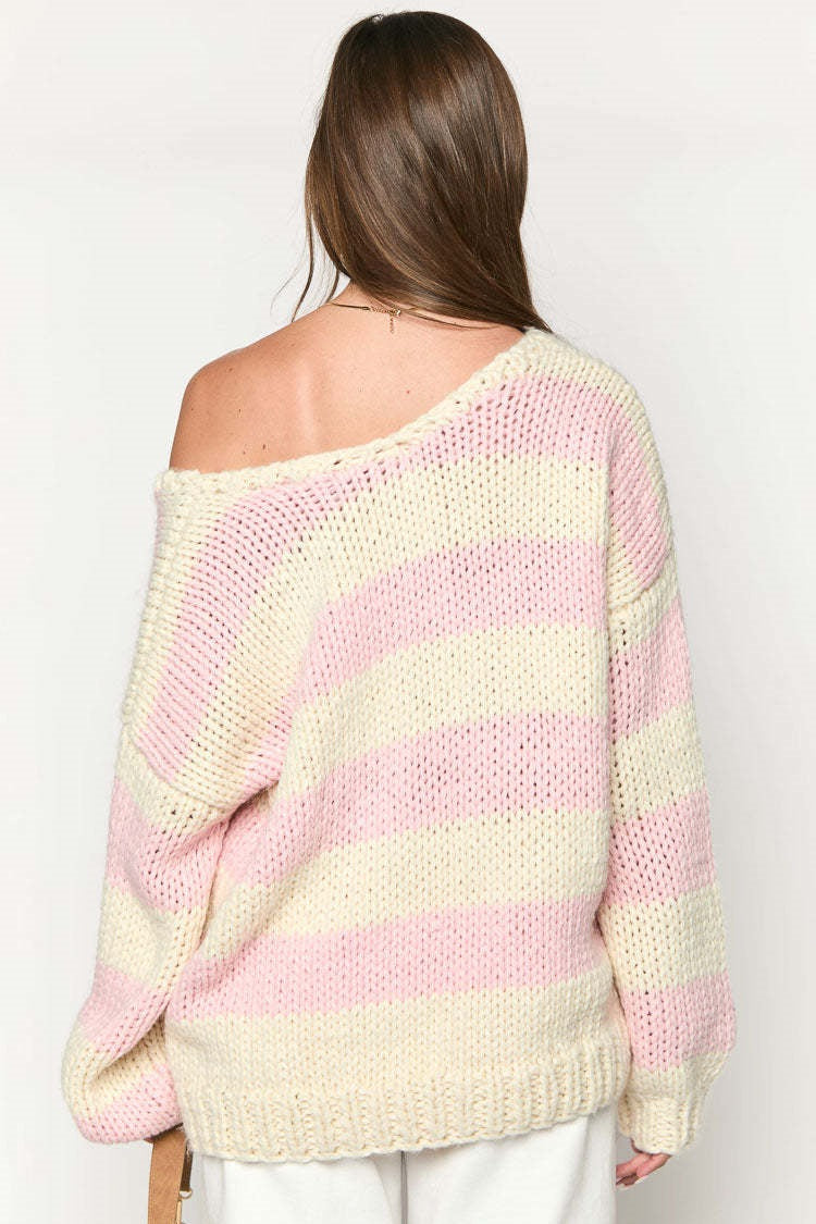 Cozy knitted sweater with an off-the-shoulder striped pattern 