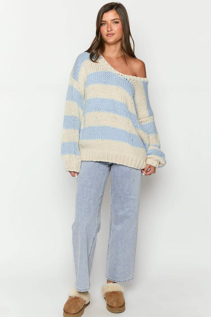 Cozy knitted sweater with an off-the-shoulder striped pattern 