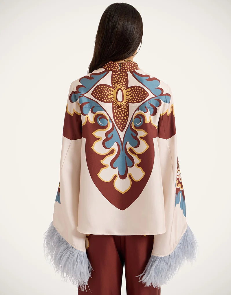 Boho top with bell sleeves, feather trim and high collar 