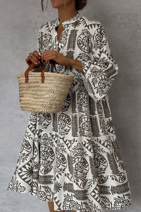 Printed mini dress with V-neck and bell sleeves 