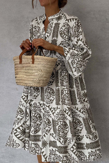 Printed mini dress with V-neck and bell sleeves 