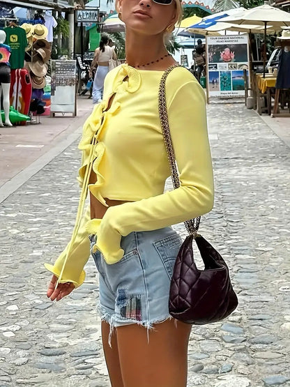 Cozy cardigan with ruffles and knot detail at the front 