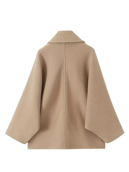 Oversized jacket with fold-down collar and side pockets 
