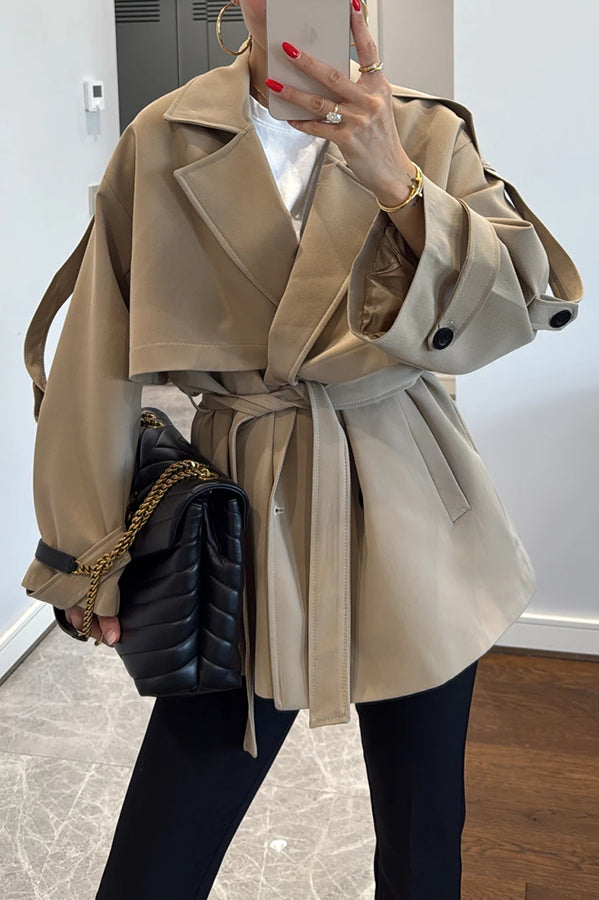Fashionable urban trench coat with belt, lapels and button details 