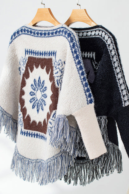 Boho knit sweater with tassel hem 