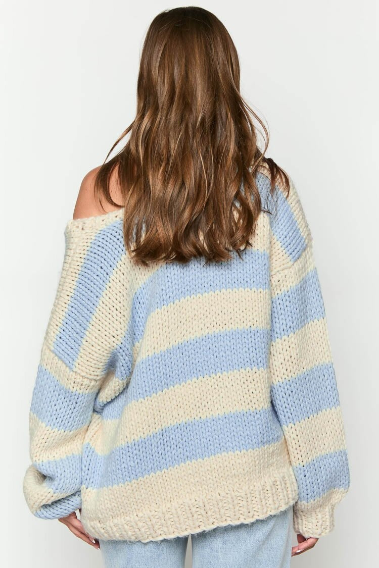 Cozy knitted sweater with an off-the-shoulder striped pattern 