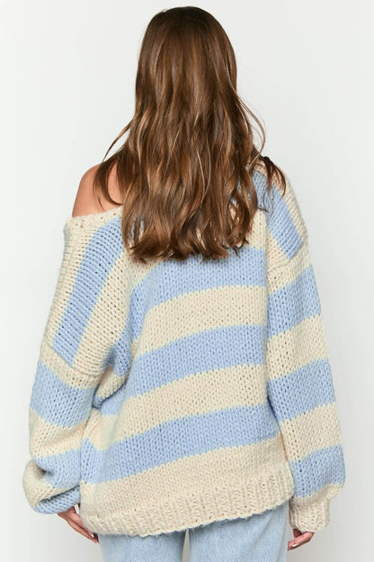 Cozy knitted sweater with an off-the-shoulder striped pattern 