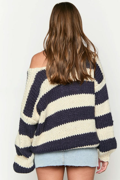 Cozy striped knit sweater with off-the-shoulder design. Chic autumn sweater. 