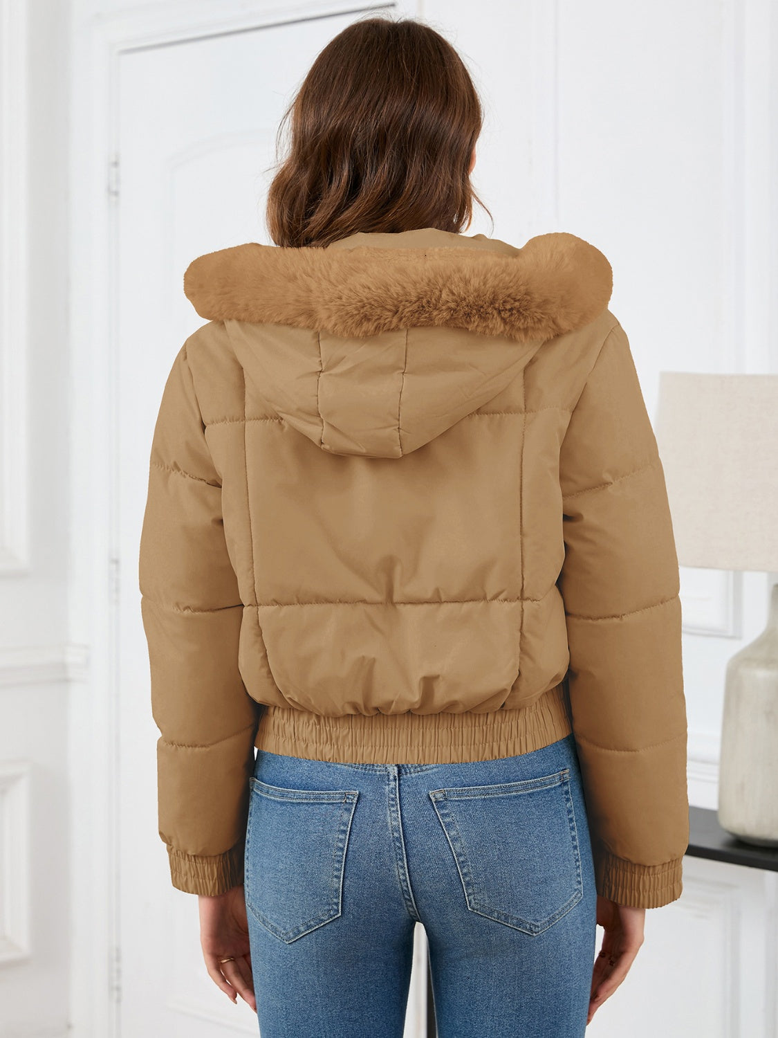 Cozy padded winter jacket with fur hood and pockets 