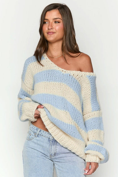 Cozy knitted sweater with an off-the-shoulder striped pattern 