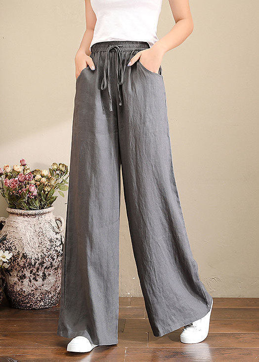 Trousers in French grey linen with wide legs, elasticated waistband and pockets 