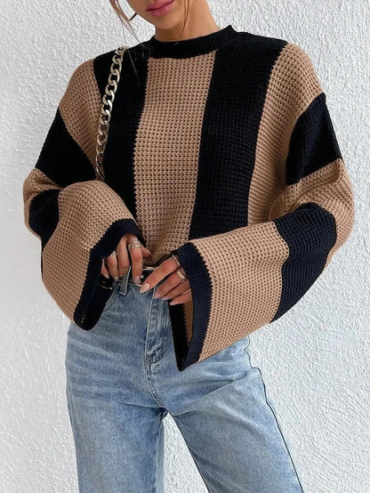 Cozy two-tone knit sweater with wide, casual sleeves