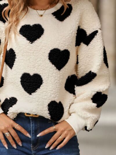 Cozy knit sweater with a heart pattern for casual comfort 