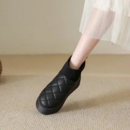 Cozy knitted sock booties with a thick sole and warm lining 