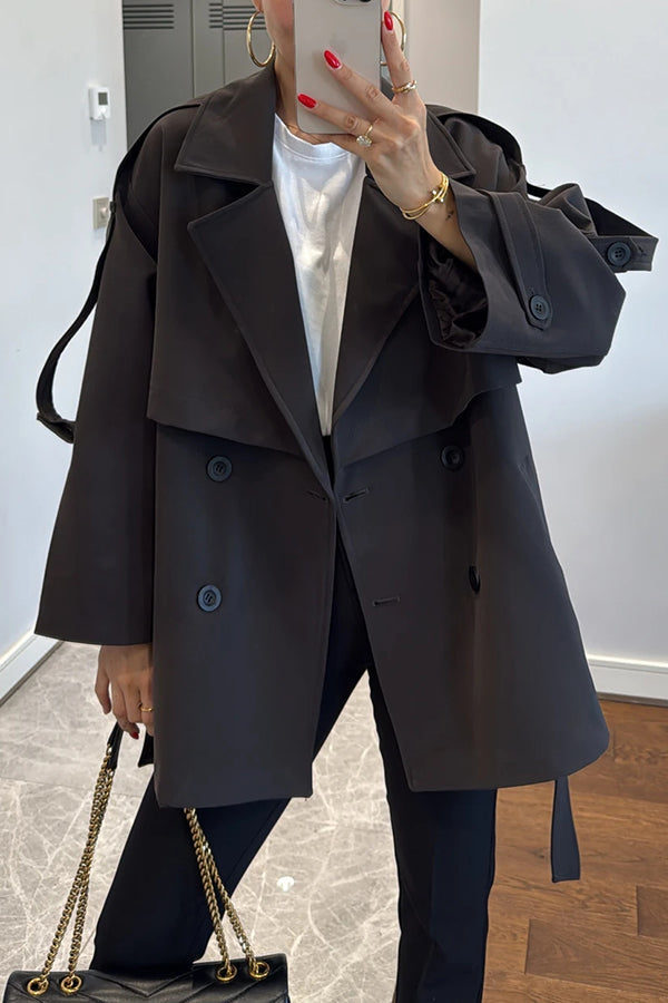 Fashionable urban trench coat with belt, lapels and button details 