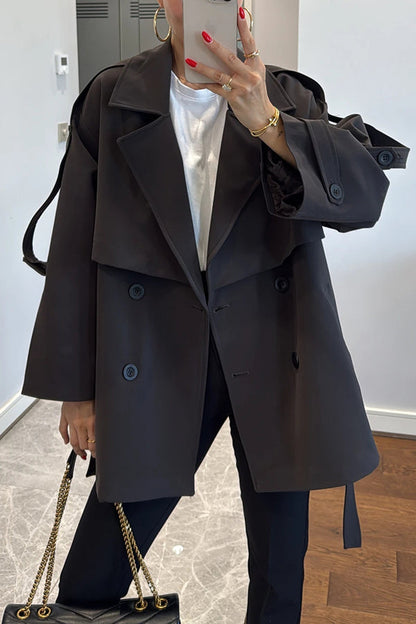 Fashionable urban trench coat with belt, lapels and button details 