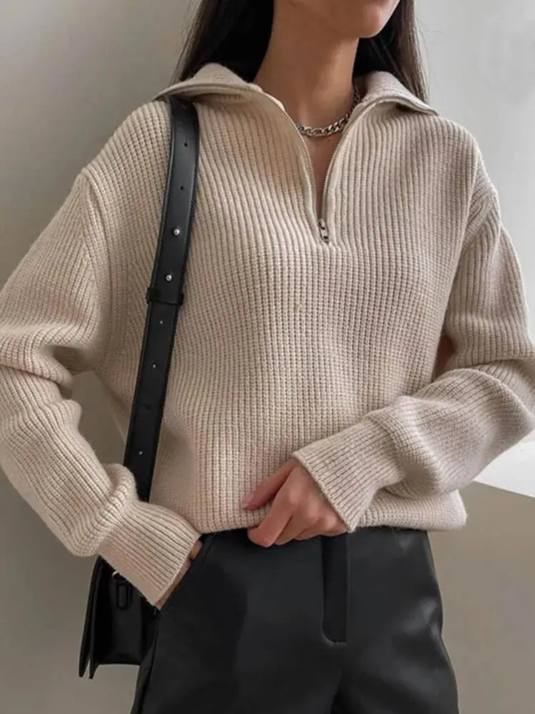 Cozy thick knit sweater with zip collar for autumn layering. 