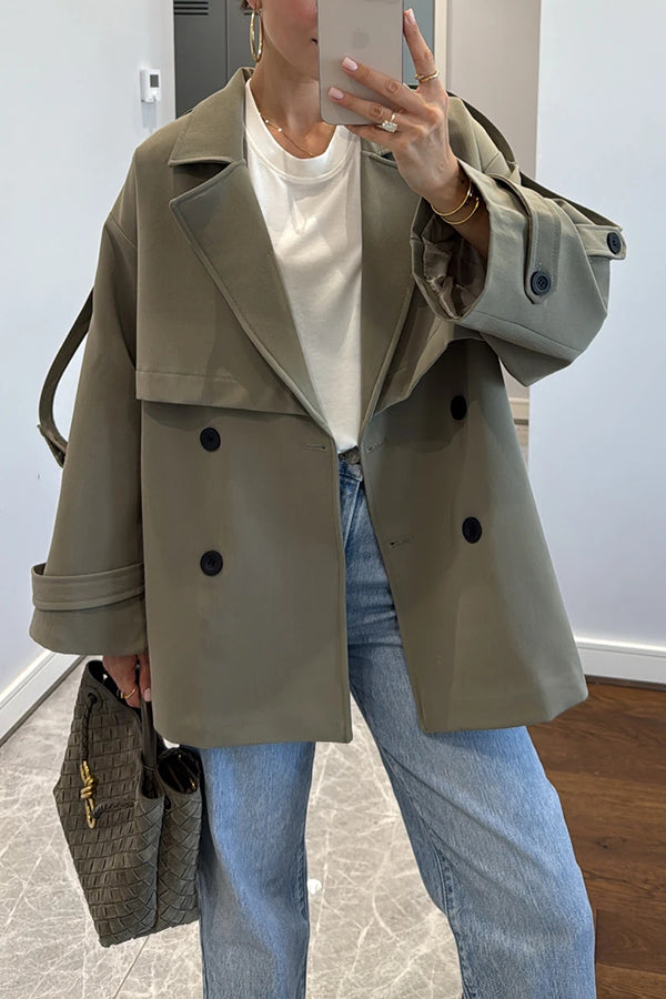 Fashionable urban trench coat with belt, lapels and button details 