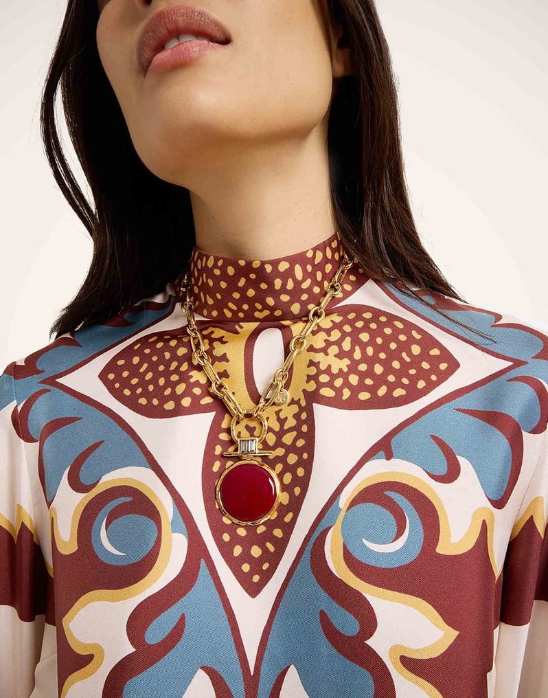 Boho top with bell sleeves, feather trim and high collar 