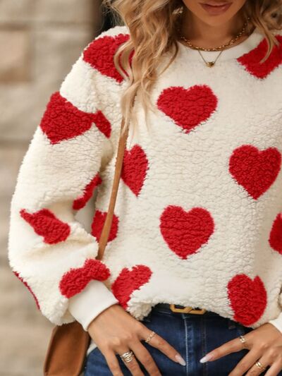 Cozy knit sweater with a heart pattern for casual comfort 