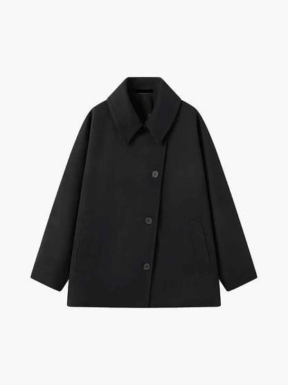 Oversized women's winter coat with lapel collar and asymmetrical buttons 