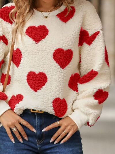 Cozy knit sweater with a heart pattern for casual comfort 