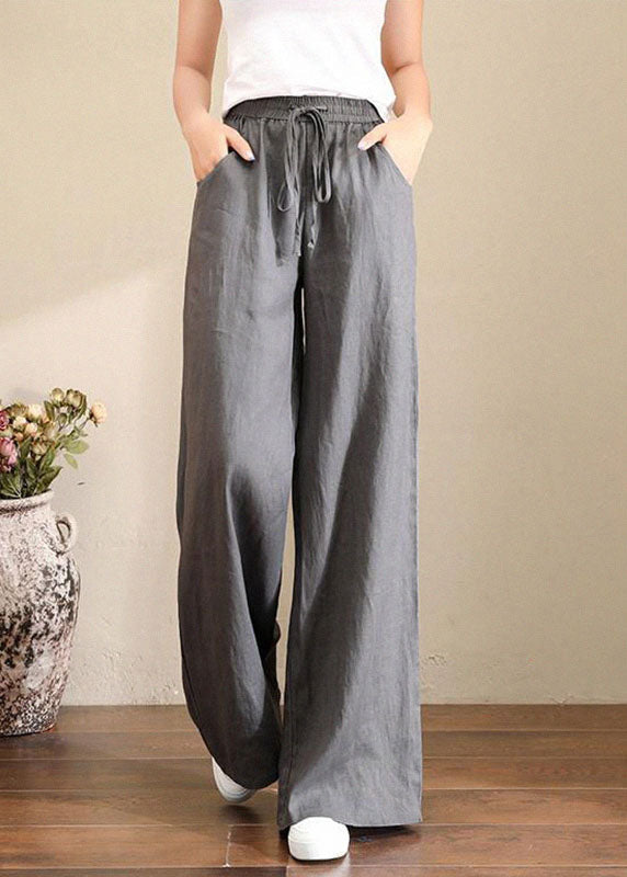 Trousers in French grey linen with wide legs, elasticated waistband and pockets 