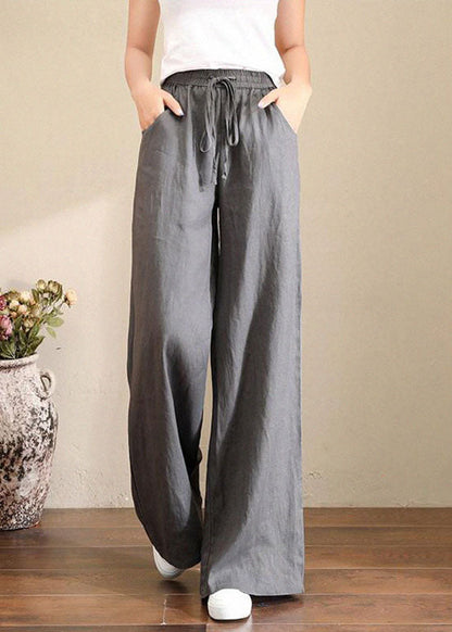 Trousers in French grey linen with wide legs, elasticated waistband and pockets 