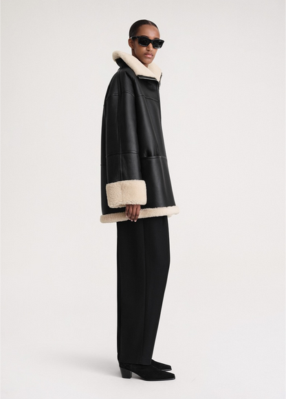 Cozy winter coat made of faux fur 