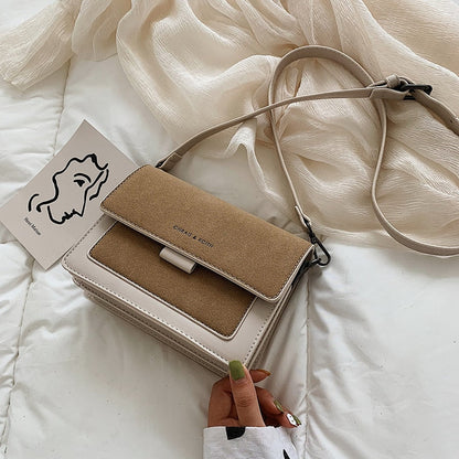 Melisi™ - Wide-band shoulder bag